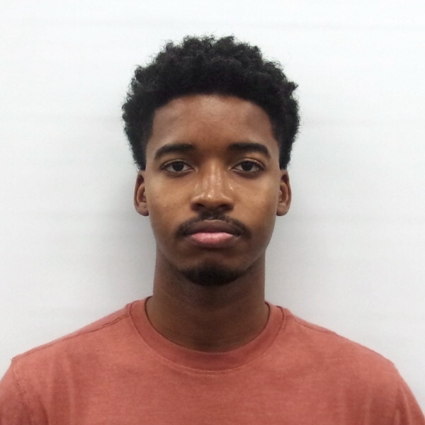 Professional headshot of Seun Dada, Full Stack Developer